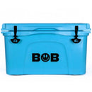 The Bob The Cooler Co. 50 QT/47.3L Hard Cooler - El Amigo by Bob - The Cooler Co. is a spacious blue cooler featuring black latches and the word "BOB" printed on the front, with a smiley face and lightning bolt eyes inside the "O." This insulated hard cooler also includes a removable dry basket for added convenience.