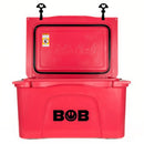 A red Bob The Cooler Co. 50 QT/47.3L Hard Cooler - El Amigo with an open lid, featuring the BOB logo on the front and "Bobs Cool" embossed inside the lid. Two black latches are visible at the top, and its extra-thick insulated walls help keep your items cold for longer.