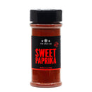 The Spice Lab Sweet Paprika Powder comes in a clear plastic jar with a black lid, featuring “Sweet Paprika” prominently in bold red letters. This 4.1 oz (116g) jar contains vivid red sweet paprika powder with a mild pepper flavor, from The Spice Lab.