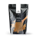 A black and white bag labeled The Spice Lab Ground Coriander 1 lb Bulk Foodservice Spice, featuring an image of ground coriander and a wooden spoon on the front—perfect for BBQ restaurants or anyone seeking a foodservice size option.