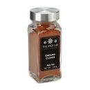 A glass jar with a metal lid, branded The Spice Lab and labeled Ground Cloves, contains finely ground brown cloves—an essential bulk spice for enhancing both your baking and curry recipes.