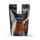 A black resealable pouch of The Spice Lab Scorpion Chile Powder by The Spice Lab is shown, featuring a white label at the top and a splash graphic behind a wooden spoon heaped with reddish-brown chile powder on the front—hinting at the extreme heat packed inside this hot pepper powder.