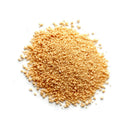 A small pile of The Spice Lab Granulated Honey, a coarse, light brown honey powder from The Spice Lab, is spread on a white background.