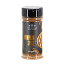 A clear plastic jar of The Spice Lab Pumpkin Pie Spice features a black cap and a label adorned with images of pumpkin pie and spices. This ground seasoning blend from The Spice Lab is perfect for Fall baking and adds a cozy touch to your favorite treats.