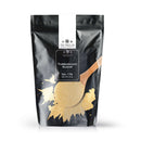 A black resealable bag labeled The Spice Lab Turbinado Sugar features a graphic of a wooden spoon filled with this less processed sugar and a sugar spill on the front. Ideal for sweetening, it comes in a 2 lb net weight.