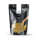 A black resealable bag labeled The Spice Lab Ground Oregano features an image of ground oregano and a wooden spoon on the front, showcasing this classic Mediterranean herb as a must-have everyday seasoning. Net weight is 1 lb.