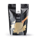 A black resealable pouch from The Spice Lab, labeled “The Spice Lab Ground White Pepper,” features a spoon and pepper powder graphic on the front. This 4-ounce package contains premium ground white pepper, ideal for seasoning dishes or bulk foodservice applications.