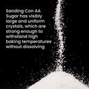 A cascade of coarse sugar crystals tumbles onto a pile, accompanied by text highlighting The Spice Lab’s Sanding Con AA Sugar and its large, uniform crystals that resist dissolving even at high baking temperatures—ideal as sanding sugar for decorative baking or as cupcake sprinkles to add a sparkling finish.