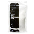 A resealable bag of The Spice Lab Sanding Con AA Sugar, labeled as extra coarse and non-GMO, features visible white crystalline sugar inside—ideal as sanding sugar for decorative baking or for adding a sparkling finish to cupcake sprinkles.