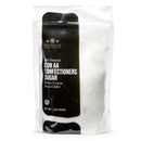 A clear plastic bag of The Spice Lab Sanding Con AA Sugar, all-natural extra coarse non-GMO sugar with a black label, weighing 2 pounds—ideal for decorative baking or as sanding sugar to add sparkle and texture to your treats.