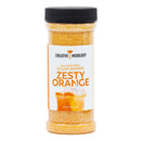 A clear plastic container of The Spice Lab Zesty Orange Sugar Cocktail Rimmer, perfect as a margarita rimmer or orange cocktail rimming sugar, featuring a label with an orange drink topped with whipped cream. The container has a black lid and contains 11 oz (311 g) of product—ideal for crafting the ultimate citrus cocktail garnish.