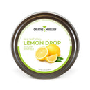 A 3.5 oz (99g) tin from The Spice Lab, labeled “Lemon Drop Sugar Cocktail Rimmer,” features images of whole and sliced lemons on the lid—perfect for adding a zesty touch to your favorite citrus cocktails.