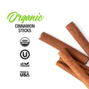 Four The Spice Lab Organic Cinnamon Sticks rest on a white background, evoking the warm, inviting aroma of chai or mulled wine. To the left are USDA Organic, Kosher, and All Natural certification logos, along with a “Packed in USA” label.