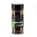 A clear plastic bottle of The Spice Lab Organic Black Tellicherry Peppercorns Whole, featuring a black lid and green label, net weight 4.7 oz (133g), shown on a white background.