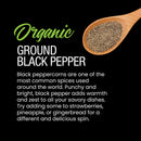 A wooden spoon filled with The Spice Lab Organic Ground Black Pepper sits beside text highlighting its versatile uses and bold flavor—suggesting that you try adding it to strawberries, pineapple, or gingerbread, or mix it into your favorite seasoning blends from The Spice Lab for a distinctive taste experience.