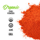 A vibrant pile of The Spice Lab Organic Chili Powder is shown on a white background, featuring text for Organic Chili Powder alongside certification logos for USDA Organic, All Natural, Kosher, and Packed in the USA. Ideal for spicy rubs and authentic Mexican seasonings, this organic chili powder from The Spice Lab delivers bold flavor to all your favorite dishes.