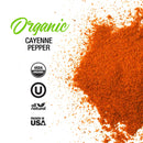 A vibrant mound of The Spice Lab Organic Cayenne Pepper powder is displayed on a white background, featuring labels such as “USDA Organic,” “All Natural,” and “Packed in USA.” This organic cayenne pepper from The Spice Lab is perfect for adding bold heat to Mexican and Indian cuisine.