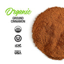 A heap of high-oil ground cinnamon from The Spice Lab is displayed on a white background, accompanied by the text “The Spice Lab Organic Ground Vietnamese Saigon Cinnamon” and certification icons for USDA Organic, Kosher, All Natural, and Packed in USA.