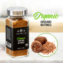 A jar of The Spice Lab Organic Ground Nutmeg rests on a countertop alongside whole and grated nutmeg, ready to bring warm, festive flavor to your holiday baking or eggnog. The label features “The Spice Lab Organic Ground Nutmeg” in green and black text on a white background.