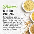 Bowls filled with The Spice Lab Organic Ground Mustard, mustard powder, whole mustard seeds, and a zesty mustard sauce are artfully arranged on a white wooden surface, with scattered seeds lending a rustic touch. Perfect for enhancing cheese dishes or customizing your favorite spice blends, The Spice Lab’s Organic Ground Mustard delivers robust, organic flavor to any recipe.