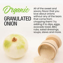 A whole onion sits next to a small wooden container pouring out The Spice Lab Organic Granulated Onion onto a white surface, with text highlighting its versatility as an essential pantry staple—perfect for dips, eggs, BBQ rubs, salads, soups, and more.