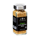 A clear glass jar with a silver lid, labeled The Spice Lab Organic Whole Mustard Seeds by The Spice Lab, containing yellow mustard seeds—perfect for brining or pickling your favorite dishes. Net weight: 2.6 oz (45g).