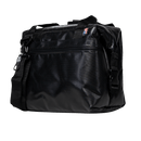 Black cooler bag by Black Bison, with top zipper, buckle strap and American flag label.
