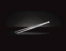 The Napoleon Grilling Pincer Tongs (55025) by Napoleon Grills, a sleek silver tool ideal for delicate food handling, are set against a black background with a subtle reflection beneath.