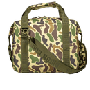Duck camouflage SoftPak cooler by Bison Coolers, featuring green straps and a durable-looking, patterned material.
