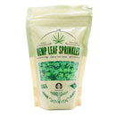 A light green package of The Spice Lab Hemp Leaf Sprinkles CBD & THC Free, featuring green leaf-shaped sprinkles visible through a clear window, ideal for edible party decorations; labeled CBD & THC free and made in the USA.