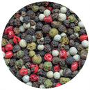 A close-up of mixed peppercorns—black, white, green, and red—filling a circular frame, highlighting their vibrant colors and distinct textures in this lively blend. Ideal for use with The Spice Lab Premium Kings Peppercorn Grinder from The Spice Lab, it’s perfect for adding a burst of freshly ground flavor to your favorite dishes.