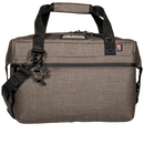 Shale soft-sided cooler by Bison Coolers with black straps and a branded bottle opener.