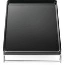 The Napoleon Cast Iron Griddle for Large SIZZLE ZONE® (56082) by Napoleon Grills is a black rectangular griddle with raised edges on a silver wire frame, viewed from above—ideal for flat top cooking.