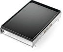 The Napoleon Cast Iron Griddle for Large SIZZLE ZONE® (56082) by Napoleon Grills is a rectangular black griddle with raised edges and a silver metal frame featuring the NAPOLEON logo, ideal for flat top cooking.