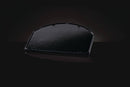The Napoleon Grills Cast Iron Reversible Griddle for 22" Charcoal Grills (56083) is shown in black with a semi-circular, textured, porcelain-enameled finish and raised edge, displayed on a dark reflective surface against a black background.