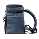 Navy blue soft-sided cooler bag by Switchback, shown in a side view with black carrying straps and black keychain.
