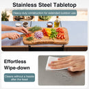 A person chops veggies on the DirectDeals Outdoor Grill Table 59″ with Removable Shelves & Storage, while another wipes the surface below, highlighting its easy-to-clean and durable outdoor design.