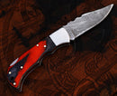 The Texan Knives Personalized Damascus Steel Pocket Knife features a patterned blade, red and black wood handle with silver accents—a custom folding knife and unique Valentine’s Day gift for your husband.