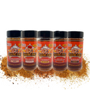 Five bottles from the Blazing Star BBQ Ultimate Seasoning Bundle are lined up in front of a colorful mix of spices, each bottle labeled with a different flavor variety and featuring a cartoon mascot on the packaging—an irresistible BBQ seasoning set from Blazing Star BBQ, a veteran-owned brand known for its spicy BBQ rubs.