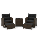 The DirectDeals 5 Pieces Patio Rattan Furniture with 2 Ottomans and Tempered Glass Coffee Table-Red creates a cozy outdoor conversation area, featuring armchairs, ottomans, and a matching table on a white background.