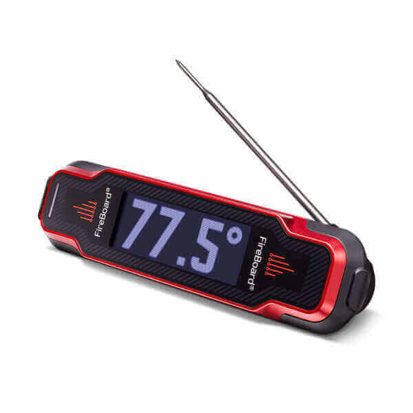 A digital meat thermometer with a red and black casing displays a temperature of 77.5 degrees on its screen. The metal probe is extended, and the FireBoard brand name is visible on the device.
