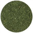 A close-up, top-down view of The Spice Lab Dill Weed Whole by The Spice Lab, featuring finely chopped and vibrant green dried dill weed, displayed in a circular frame on a white background.