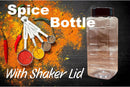 Butcher BBQ 33 oz BBQ Spice Bottle Empty with shaker lid displayed on a dark surface beside measuring spoons filled with vibrant spices and herbs—ideal for grill seasoning blends or rub refills. Large text: “Butcher BBQ Spice Bottle With Shaker Lid.”.