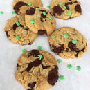 The Spice Lab Hemp Leaf Sprinkles CBD & THC Free are sprinkled atop chocolate chip cookies, adding a playful green touch from The Spice Lab that makes for charming, edible party decorations—all without any CBD or THC.
