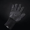 The Napoleon Heat Resistant BBQ Glove (62145) by Napoleon Grills is shown against a dark background. This black aramid fiber glove with white stripes features a textured palm, extended wrist coverage, and excellent heat resistance for grilling.