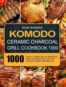 Cover of Komodo Ceramic Charcoal Grill Cookbook 1000: 1000 Days Yummy, Relax Recipes and Techniques for the World's Best Barbecue - Hardcover by Books by splitShops, featuring an enticing collage of grilled meats and vegetables arranged beautifully to highlight irresistible barbecue recipes. The book title stands out in bold yellow letters, making it the ideal kamado grill cookbook for anyone using a ceramic charcoal grill.