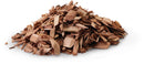 Napoleon Grills Apple Wood Chips (67007) are small, irregular brown chips spread on a white surface—perfect for adding mild smoke flavor to your dishes.