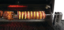 A close-up of the Napoleon Commercial Grade Rotisserie Kit 69231 in a Prestige® 500 grill, roasting whole chickens and ham with pineapple over heated grates.