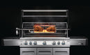 A Napoleon Grills Commercial Grade Rotisserie Kit for Charcoal PRO Grill PRO605CSS is roasting two browned chickens over an open flame, with smoke rising against a dark background.