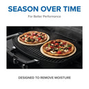 Two pizzas cook on personal stones. Text reads: Season Over Time For Better Performance. Below: Napoleon Grills 10 Inch Personal Sized Pizza/Baking Stone Set (70000) is designed to remove moisture—for deliciously crispy homemade pizza every time.